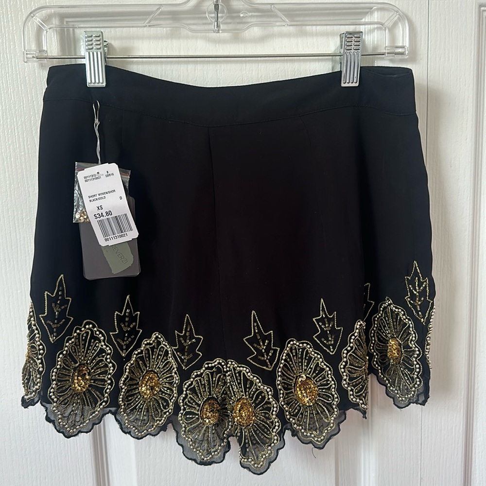 Never worn and NWT Forever 21 black and gold shorts